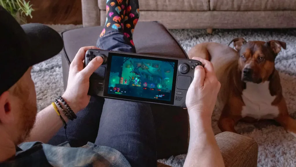 man playing steam deck in living room environment