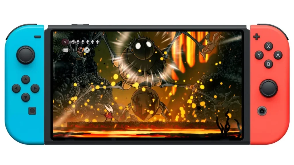 Hollow Knight Silksong Switch gameplay showing Hornet fighting a large boss enemy with golden particles and dramatic lighting effects