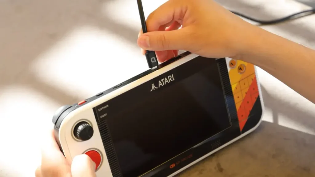 Retro handheld console with classic arcade design and vintage gaming interface