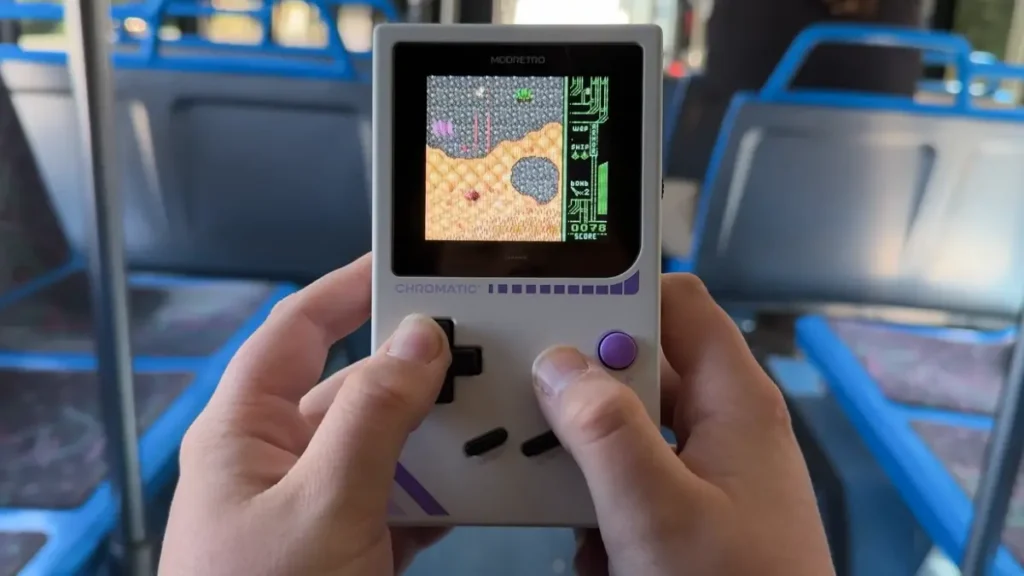 Retro handheld console displaying classic RPG game with clear screen visibility in outdoor lighting